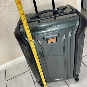 TUMI. Hard shell. Continental 4 wheels. 28”